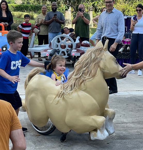 Pearl inside her horse adaptive Halloween costume.