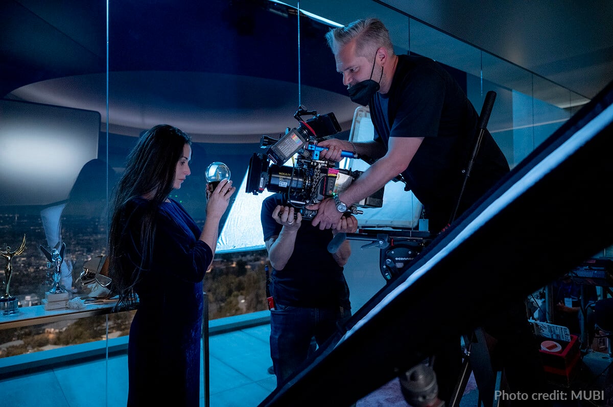 Cinematographer Benjamin Kračun and Demi Moore on set with a Rosco Day/Night SoftDrop creating nighttime views of Hollywood in the background.