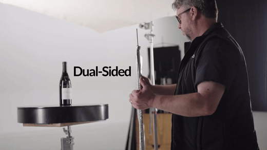 Person flipping a dual Silver Slidey during a bottle product shoot.