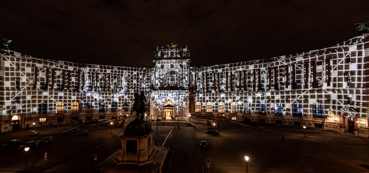 Light art installation featuring etched Permacolor dichroic glass filters illuminate Neue Burg and Heldenplatz.