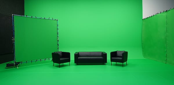 A Chroma Key Studio with a painted chroma key green wall, a vinyl chroma key green floor that is taped down with chroma key gaffer tape, a hung chroma key green backdrop, and a chroma key green butterfly.
