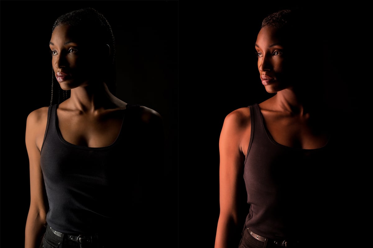 Dark-skinned woman lit with two different colour temperatures.