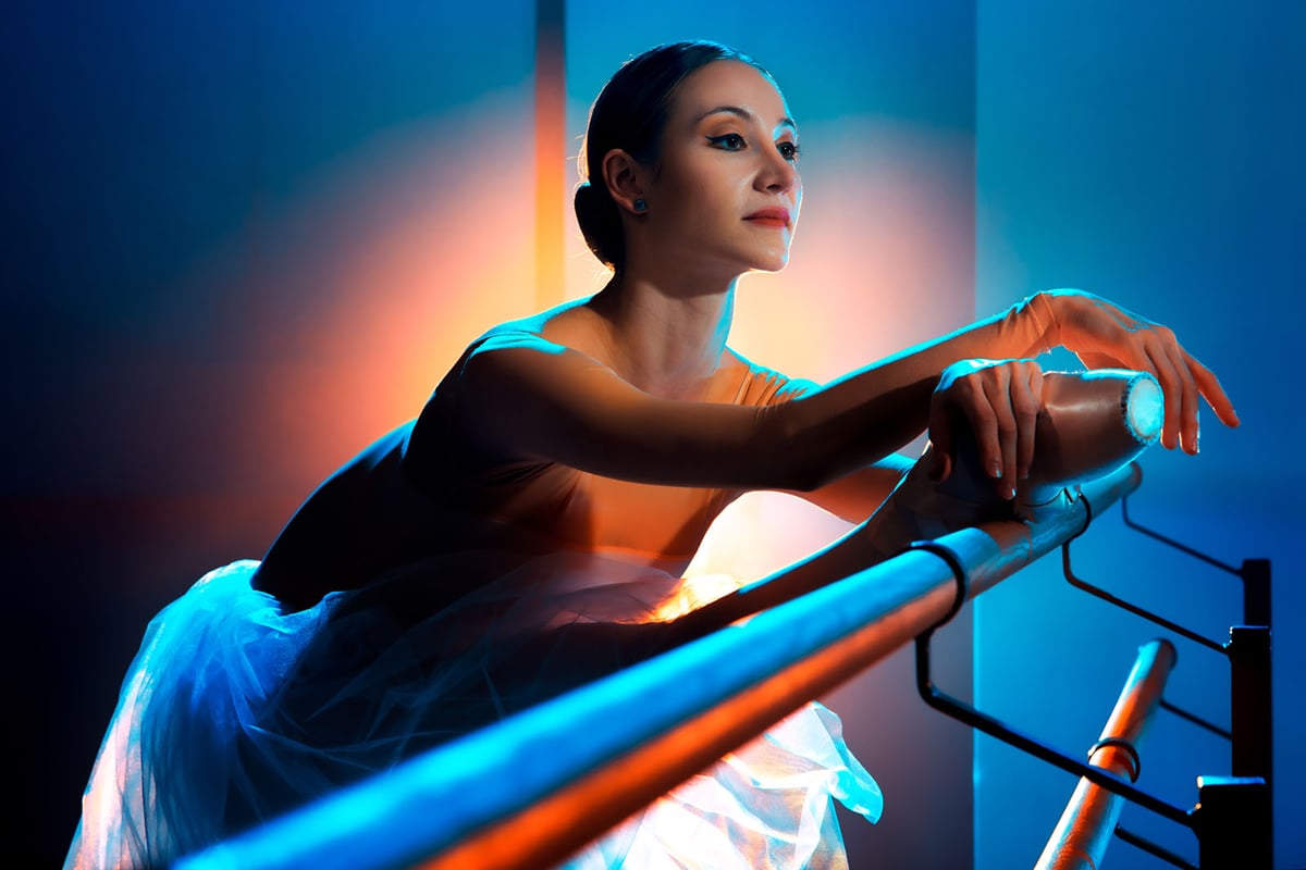 Ballet dancer lit with contrasting colors
