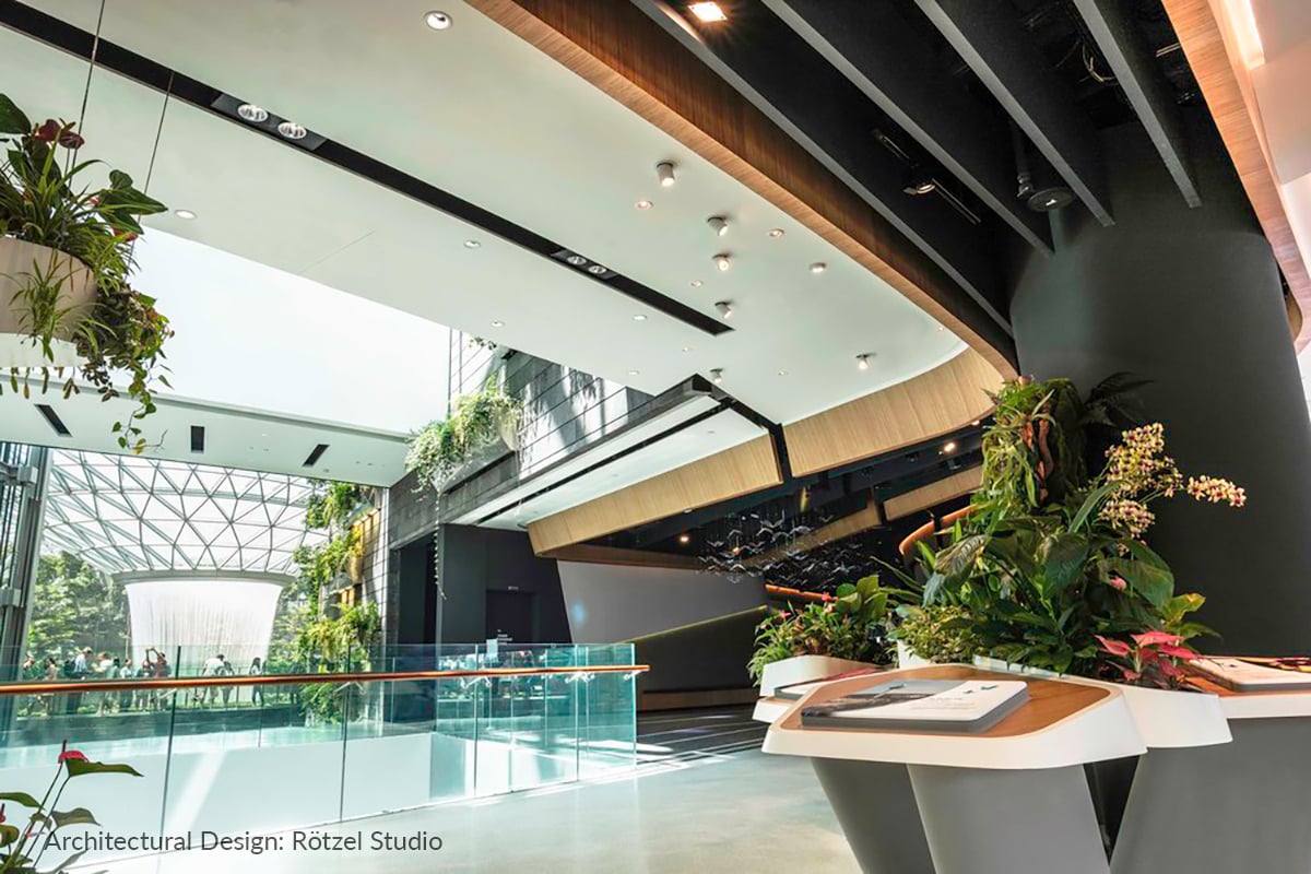 Airport lighting design featuring Rosco Miro Cube WNC fixtures integrated into the Hanging Garden exhibit at the Changi Experience Studio, Singapore Changi Airport.