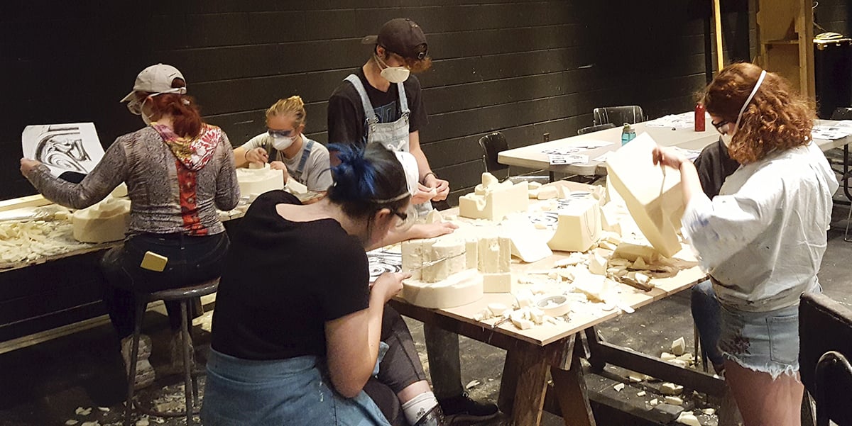 Students prepare for foam carving.