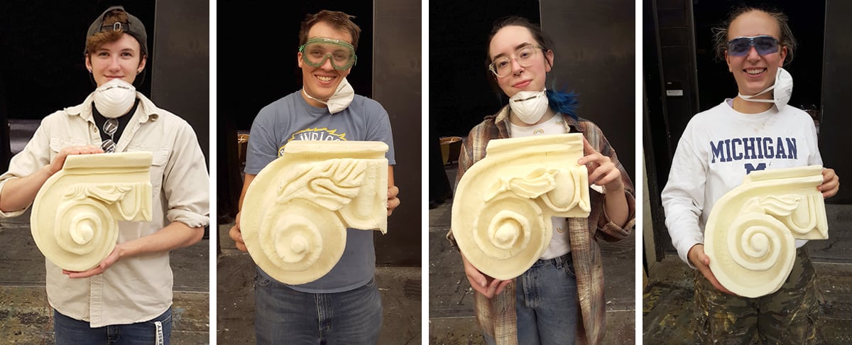 Four students hold their Ionic Capitals props.