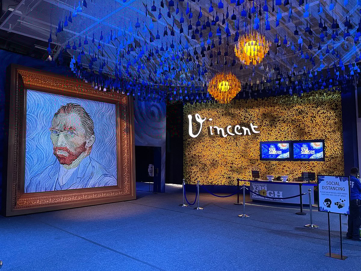 The lobby of the New York exhibition of Immersive Van Gogh featuring OPTI-SCULPT lenses.
