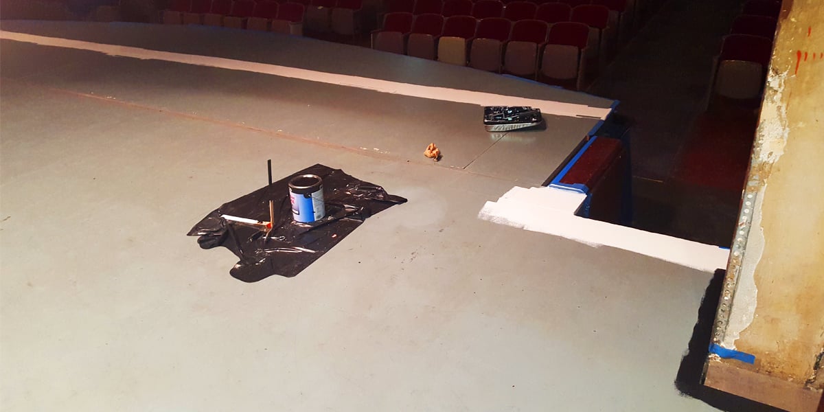 Stage floor painted in black.