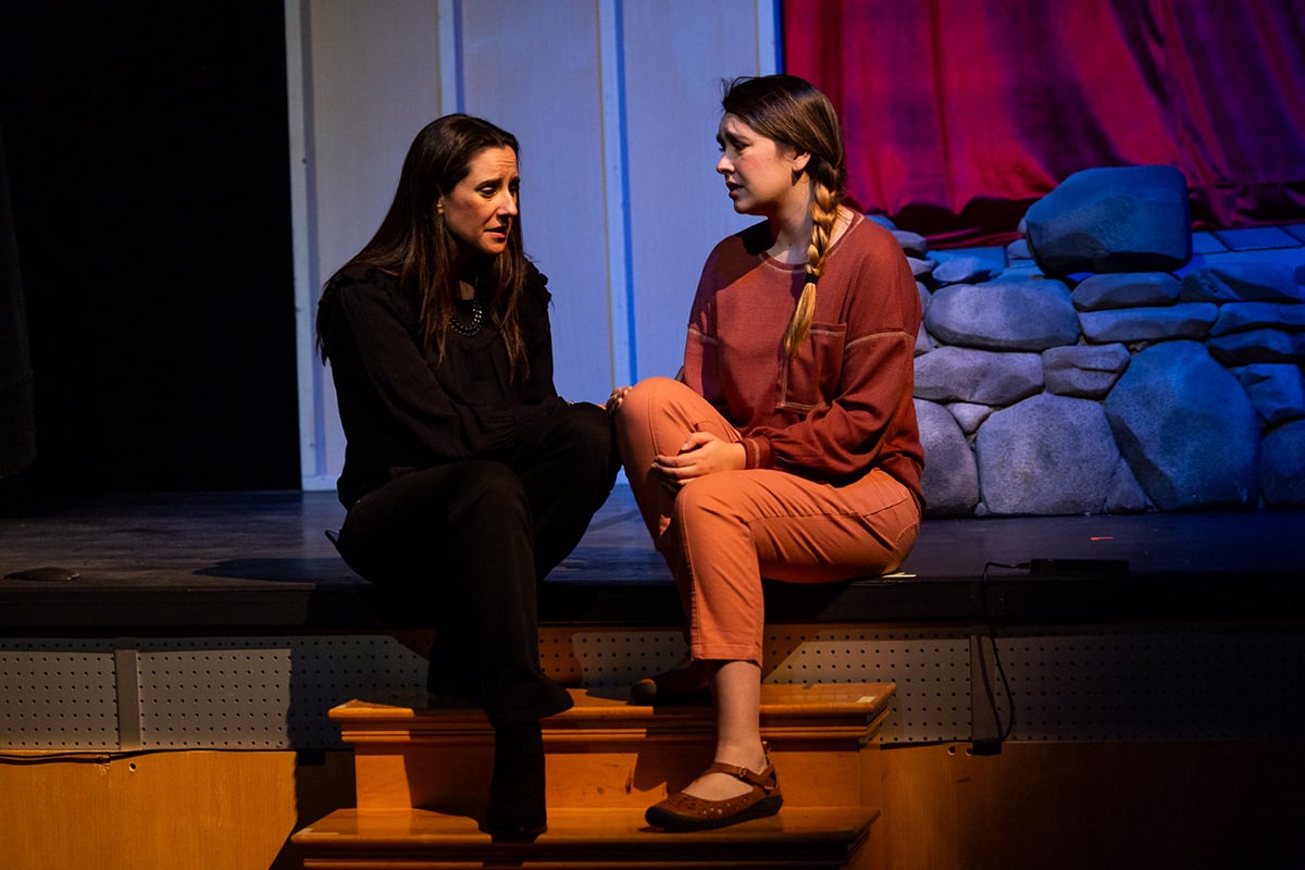 I-Cue Intelligent Mirror casts shadows and highlights on two actors on stage.