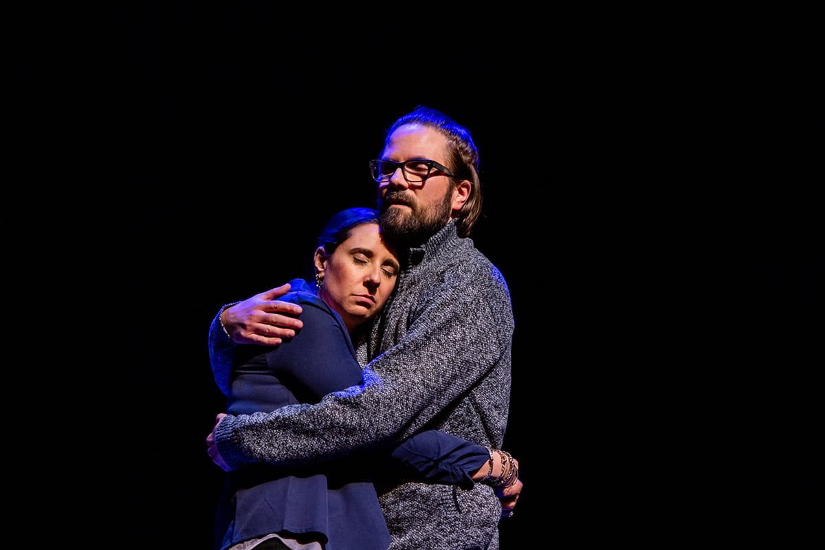 Two actors on stage are lit in warm light by I-Cue Intelligent Mirror.