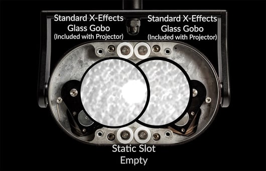 Rosco X-Effects LED Projector with two rotating glass gobo slots that are mounted off-center of the optical beam path.