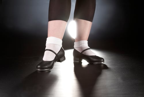 Closeup shot of a dancer tap dancing on a Rosco Adagio Floor.