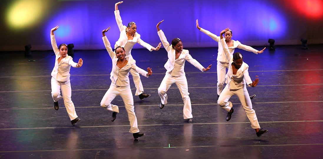 Tap dancers performing on a Rosco Adagio Tour Floor.