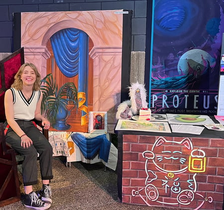 Photo of Scenic Artist Sam Meverden  posing with her Neon scenery project that she painted with Rosco Fluorescent Paint.