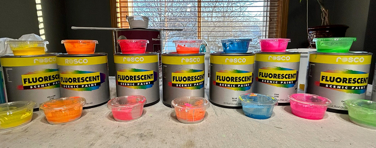 Rosco Fluorescent Paint cans with color samples.