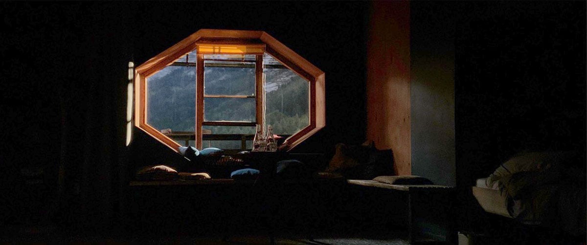 A Rosco SoftDrop creates a nighttime view of snowy mountains outside Carag's room set.